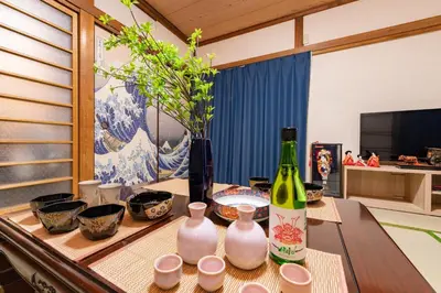 a room with a table with two bottles of wine at 634 Musashi Feel Traditional-Japanese culture,Ikebukuro-area in Tokyo