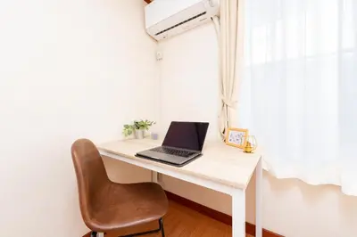 a desk with a laptop and a chair on it at 634 Musashi Feel Traditional-Japanese culture,Ikebukuro-area in Tokyo
