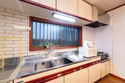 a kitchen with a sink and a microwave at 634 Musashi Feel Traditional-Japanese culture,Ikebukuro-area in Tokyo