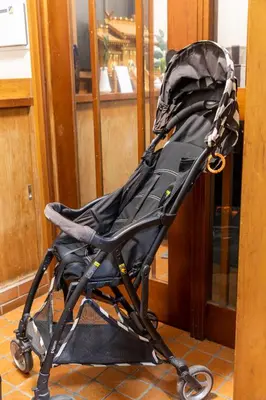a black stroller sitting in front of a door at 634 Musashi Feel Traditional-Japanese culture,Ikebukuro-area in Tokyo