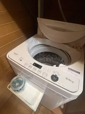 a toilet with a remote control in a room at \u65c5\u306e\u5bbfhitotoki in Tokyo