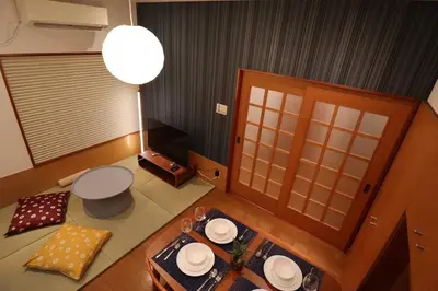 an overhead view of a room with a table and a lamp at \u65c5\u306e\u5bbfhitotoki in Tokyo