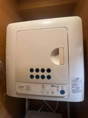 a soap dispenser on a wall in a bathroom at \u65c5\u306e\u5bbfhitotoki in Tokyo