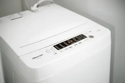 a white washer and dryer in a room at Machiya \u4eac Asakusa in Tokyo