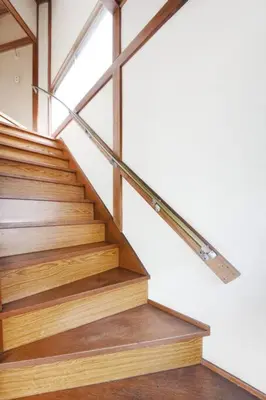 a staircase in a house with a glass railing at Machiya \u4eac Asakusa in Tokyo