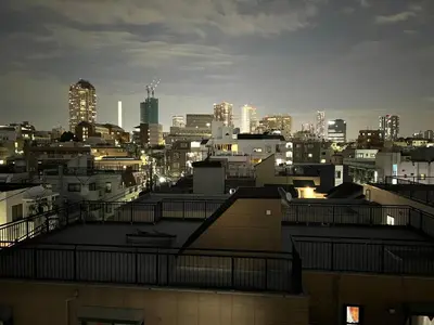 a view of a city at night with buildings at Ikebukuro Area R2 NishiikeApartment 5F No Elevator in Tokyo