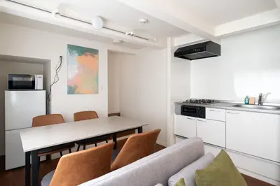 a kitchen and dining room with a table and chairs at \u6a2a\u5ddd\u30cf\u30a6\u30b9 in Tokyo
