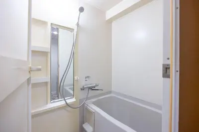 a bathroom with a bath tub and a shower at \u5357\u9752\u5c71227\u30d3\u30eb in Tokyo