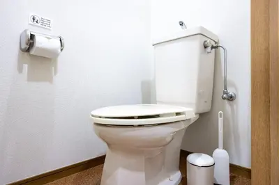 a bathroom with a toilet in a stall at \u5357\u9752\u5c71227\u30d3\u30eb in Tokyo
