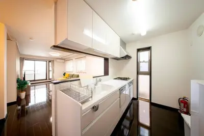 a kitchen with white cabinets and a counter top at \u6c60\u888b\u5f92\u6b6911\u5206\u8981\u753a\u99c53\u5206 3\u968e\u5efa\u3066\u4e00\u8ed2\u5bb6 \u6700\u59278\u4eba \u8cb8\u5207 \u30ad\u30c3\u30c1\u30f3\u8a2d\u5099\u5b8c\u5099 \u5bdd\u5ba44\u3064 \u30c8\u30a4\u30ec2\u3064 in Tokyo