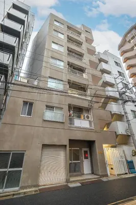 a tall apartment building with windows and balconies at Waseda BNB Shinjuku in Tokyo
