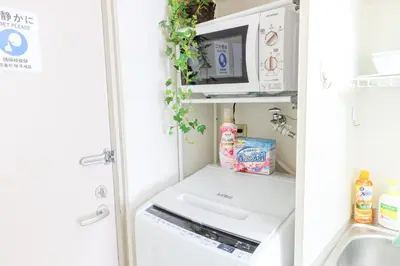 an open refrigerator with a microwave and a sink at \u30cf\u30a4\u30af\u30ec\u30b9\u30c8\u4e2d\u91ce203 in Tokyo