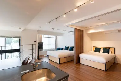 a hotel room with two beds and a sink at Lega land\u4e2d\u91ce\u5bcc\u58eb\u898b\u753a in Tokyo
