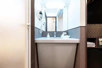 a bathroom with a sink and a mirror at Hotel Grand Fort - Vacation STAY 19307v in Tokyo