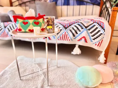 a small table with a pillow on it with a bed at High-end Tokyo shinjuku Central Park Flat 2 in Tokyo
