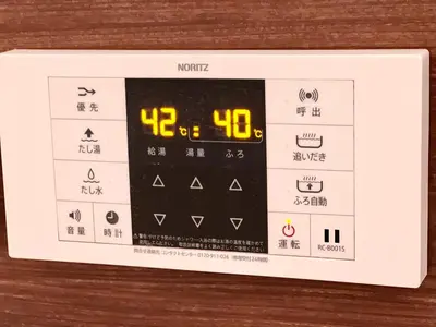 an electronic clock on a wooden table at High-end Tokyo shinjuku Central Park Flat 2 in Tokyo