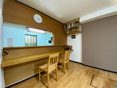 a bar in a room with a clock on the wall at \u5343\u77f3\u5bb6 in Tokyo