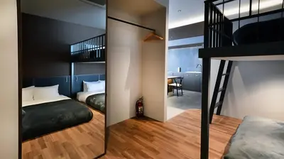 a small apartment with two beds and a bunk room at illi Gran Azabujuban in Tokyo