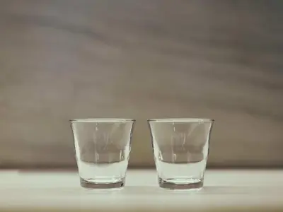 two glasses of water sitting on a table at illi Gran Azabujuban in Tokyo