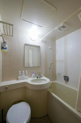 a bathroom with a sink and a toilet and a tub at #4 -\u30a8\u30af\u30bb\u30eb\u6a4b\u7acb102- Entire Unit in Tokyo