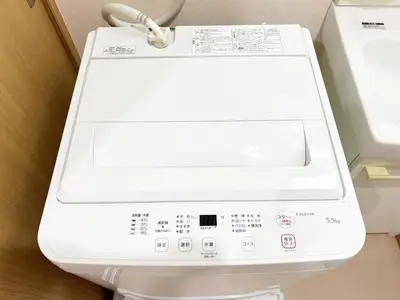 a white washing machine sitting in a room at Ueno Cozy Loft Apt Free WiFi in Tokyo