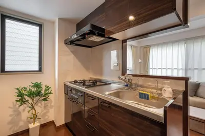 a kitchen with a sink and a stove at \u4ee3\u3005\u6728\u4e0a\u539f in Tokyo