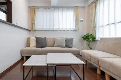 a living room with two couches and a coffee table at \u4ee3\u3005\u6728\u4e0a\u539f in Tokyo