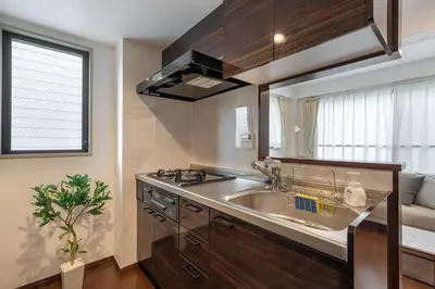 a kitchen with a sink and a stove at \u4ee3\u3005\u6728\u4e0a\u539f in Tokyo