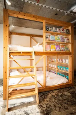 a bunk bed with a ladder in a room at MANGA ART HOTEL, BAKUROCHO - Vacation STAY 24887v in Tokyo