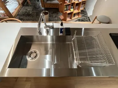a stainless steel kitchen sink with a faucet at MANGA ART HOTEL, BAKUROCHO - Vacation STAY 24887v in Tokyo