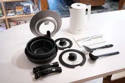 a table with a black pot and other kitchen utensils at MANGA ART HOTEL, BAKUROCHO - Vacation STAY 24887v in Tokyo