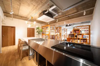 a large kitchen with a long counter in a room at MANGA ART HOTEL, BAKUROCHO - Vacation STAY 24863v in Tokyo