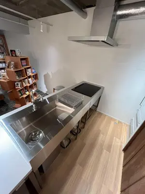 a kitchen with a stainless steel sink and a counter at MANGA ART HOTEL, BAKUROCHO - Vacation STAY 24863v in Tokyo