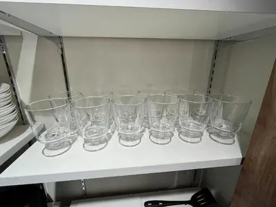 a row of glasses sitting on a shelf at MANGA ART HOTEL, BAKUROCHO - Vacation STAY 14315v in Tokyo