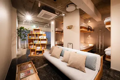 a living room with a couch and bunk beds at MANGA ART HOTEL, BAKUROCHO - Vacation STAY 14217v in Tokyo