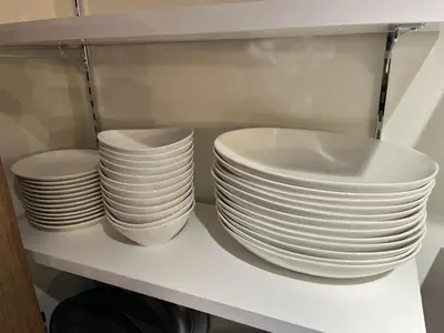 a stack of white plates sitting on a shelf at MANGA ART HOTEL, BAKUROCHO - Vacation STAY 14217v in Tokyo