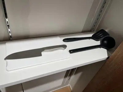 a knife and other kitchen utensils sitting on a shelf at MANGA ART HOTEL, BAKUROCHO - Vacation STAY 14217v in Tokyo
