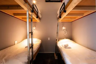 two bunk beds in a small room with two beds at MANGA ART HOTEL, BAKUROCHO - Vacation STAY 14217v in Tokyo
