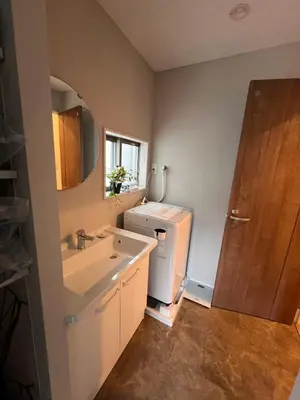 a bathroom with a sink and a white refrigerator at \u62bc\u4e0aSkytree Oshiage Hostel-KT0032 in Tokyo
