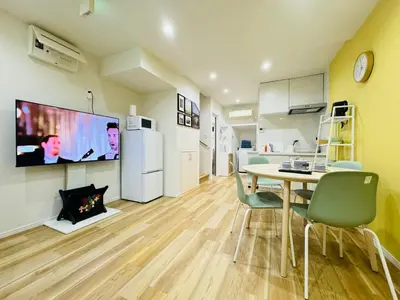 a kitchen and dining room with a table and chairs at Ueno Minowa House -TT0398 in Tokyo