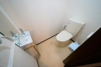 a small bathroom with a toilet and a sink at FINOA Residential Suite Kamata in Tokyo