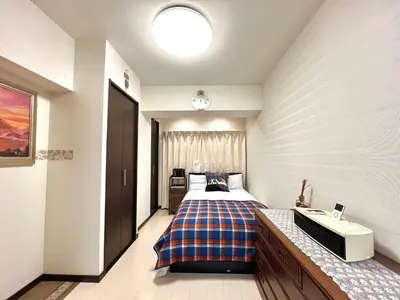 a bedroom with a bed and a sink in it at Ikebukuro 606 -TS0043 in Tokyo