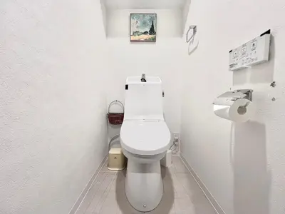 a white bathroom with a toilet and a sink at Ikebukuro 606 -TS0043 in Tokyo