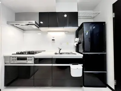 a small kitchen with a sink and a refrigerator at Ikebukuro 606 -TS0043 in Tokyo