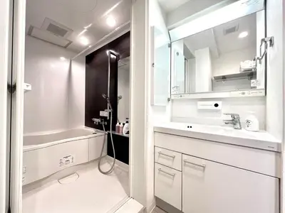 a white bathroom with a sink and a mirror at Ikebukuro 606 -TS0043 in Tokyo