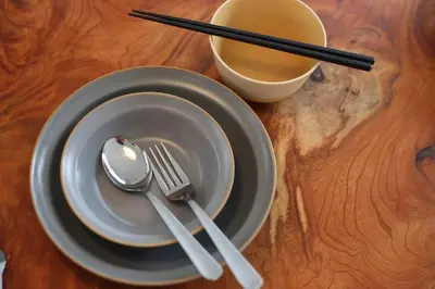 a plate with a spoon and fork and a cup of coffee at \u3077\u3075\u304b\u5c0f\u6751\u4e95 - Pufuka Omurai in Tokyo