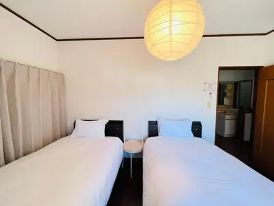 two beds sitting next to each other in a room at NN-Ōjihonchō-House-KI0174 in Tokyo
