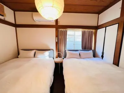 two beds sitting next to each other in a room at NN-Ōjihonchō-House-KI0174 in Tokyo