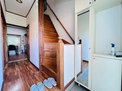 a room with a wooden staircase and white walls at NN-Ōjihonchō-House-KI0174 in Tokyo
