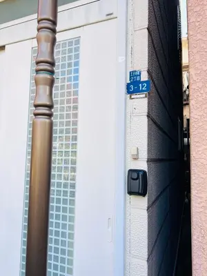 a door to a building with a street sign on it at NN-Ōjihonchō-House-KI0174 in Tokyo